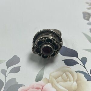 Vintage Sterling Poison ring with natural red gemstone center.